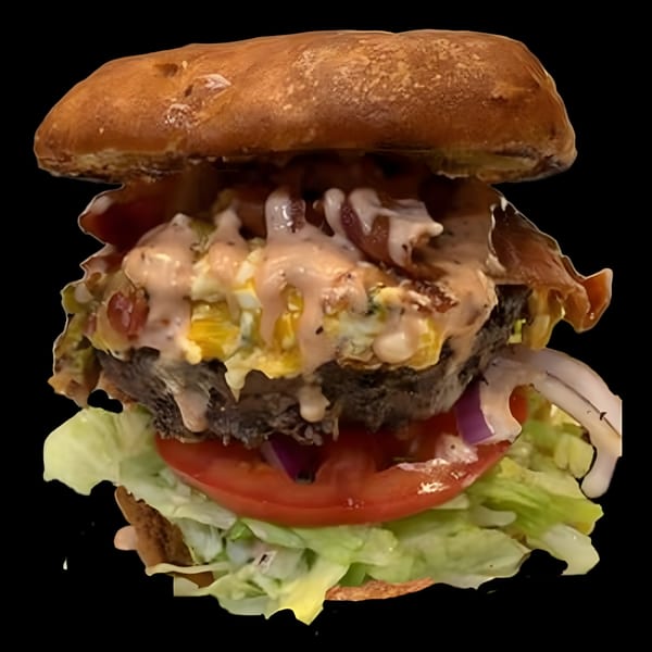 A Main Event Grill East burger with a thick patty, bacon, egg, lettuce, tomato, and sauce.
